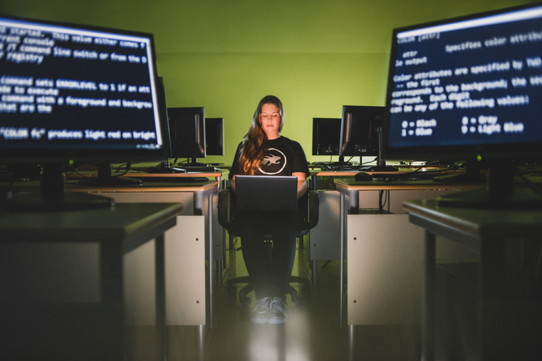 A photo of a programmer working on a computer.